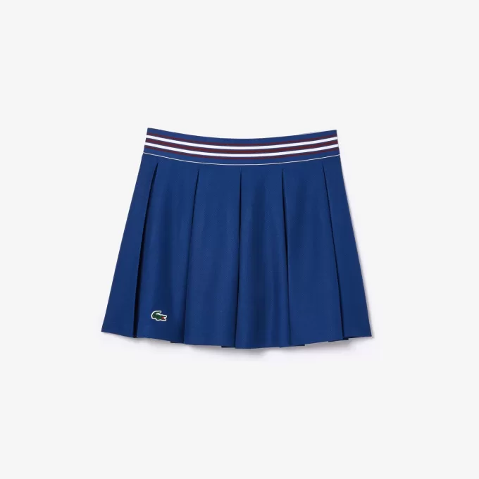 Piqué sportsnederdel med integrerede shorts
