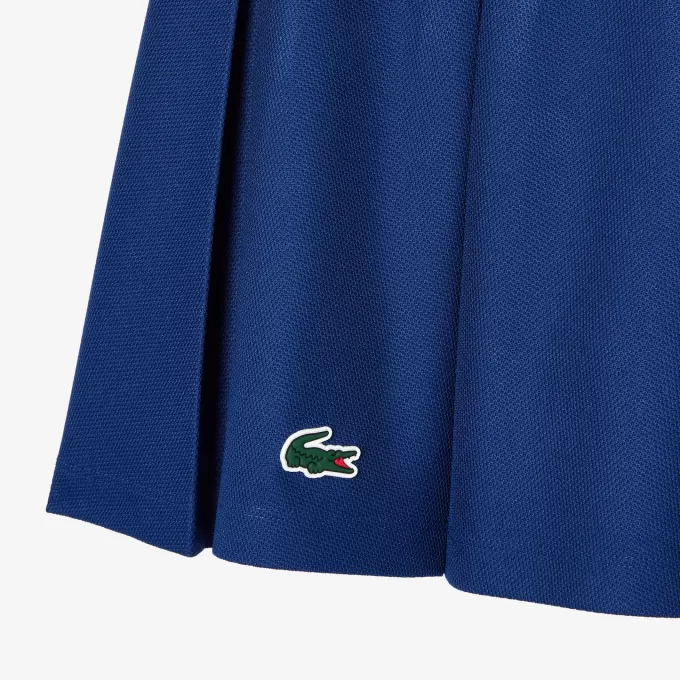 Piqué sportsnederdel med integrerede shorts