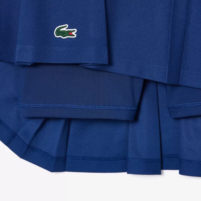 Piqué sportsnederdel med integrerede shorts