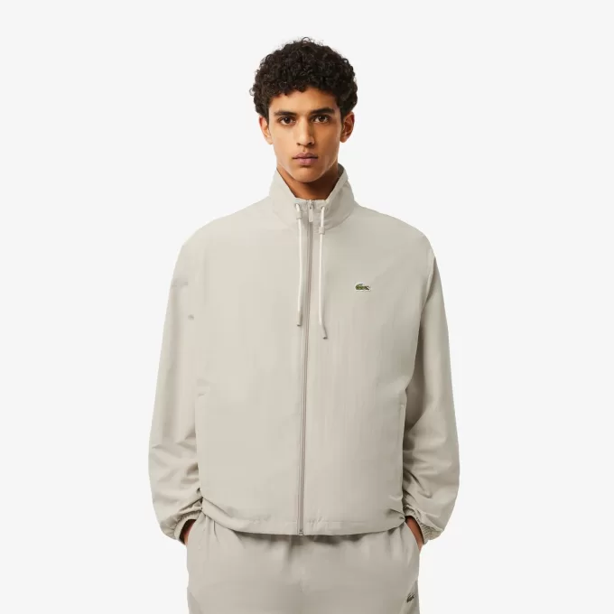 Sportsuitjakke med aftagelig hætte
